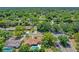 Aerial view of a residential area showing mature trees, well-maintained homes, and private pools at 1440 Suzanne Way, Longwood, FL 32779