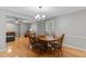 This dining room features a wooden table with seating for six and hardwood floors at 1440 Suzanne Way, Longwood, FL 32779