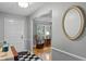 Bright foyer with checkered floors, a view into the living room, and neutral paint creates a welcoming entrance at 1440 Suzanne Way, Longwood, FL 32779