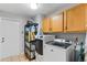 Laundry room featuring a washer and dryer, ample storage, and tile flooring at 1440 Suzanne Way, Longwood, FL 32779