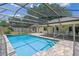 Enclosed pool with brick paved deck is accessible from the house and patio at 1440 Suzanne Way, Longwood, FL 32779