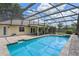Enclosed pool with brick paved deck is accessible from the house and patio at 1440 Suzanne Way, Longwood, FL 32779