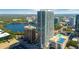 Stunning aerial view of high-rise building with lake and skyline in background at 150 E Robinson St # 2807, Orlando, FL 32801