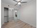Bedroom features wood floors, closet, and access to the kitchen at 150 E Robinson St # 2807, Orlando, FL 32801
