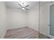 Cozy bedroom features light hardwood floors, white trim, and a modern ceiling fan at 150 E Robinson St # 2807, Orlando, FL 32801