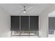 Bedroom view featuring hardwood floors, large windows with window shades, and a modern ceiling fan at 150 E Robinson St # 2807, Orlando, FL 32801