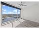 Bedroom featuring hardwood floors, large windows with a great view, and a modern ceiling fan at 150 E Robinson St # 2807, Orlando, FL 32801