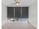 Bedroom view featuring hardwood floors, windows with window shades, and a modern ceiling fan at 150 E Robinson St # 2807, Orlando, FL 32801