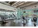 Well-equipped gym with modern exercise equipment and floor-to-ceiling windows at 150 E Robinson St # 2807, Orlando, FL 32801