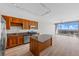 Modern kitchen with stainless steel appliances and a large island, with a view of the city at 150 E Robinson St # 2807, Orlando, FL 32801