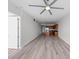 Spacious living room featuring hardwood floors, open concept kitchen with stainless steel appliances, and a modern ceiling fan at 150 E Robinson St # 2807, Orlando, FL 32801