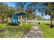 Picturesque park view with lush greenery, a walking path, and a tranquil lake at 150 E Robinson St # 2807, Orlando, FL 32801