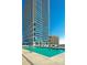 Exterior view of the building with a pool and lounge chairs for relaxation at 150 E Robinson St # 2807, Orlando, FL 32801