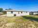 View of the rear exterior of the home showcasing its simple design and outdoor space at 1543 Sarah St, Lake Wales, FL 33898