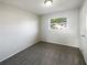 Cozy bedroom featuring neutral paint, carpeting, and natural light at 1543 Sarah St, Lake Wales, FL 33898