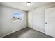 A bright bedroom with neutral walls, carpet and a window at 1543 Sarah St, Lake Wales, FL 33898