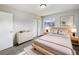 Bright bedroom featuring a plush rug, a wooden bed frame and modern decor and finishes at 1543 Sarah St, Lake Wales, FL 33898