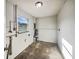 Functional bonus room with concrete floors and a bright window at 1543 Sarah St, Lake Wales, FL 33898