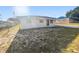 Charming single-story home with a simple design and a well-maintained front yard at 1543 Sarah St, Lake Wales, FL 33898