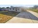 Charming single-story home with a covered carport and a spacious concrete driveway at 1543 Sarah St, Lake Wales, FL 33898