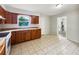Traditional-style kitchen with light countertops and tile flooring at 1543 Sarah St, Lake Wales, FL 33898
