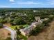 Wide aerial perspective of the beautiful townhouse complex with mature trees in a tranquil community at 1570 Barking Deer Cv, Casselberry, FL 32707
