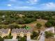 Charming townhouse complex featuring well-maintained landscaping and private driveways in a picturesque setting at 1570 Barking Deer Cv, Casselberry, FL 32707