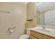Bright bathroom with a light wood vanity, white toilet, and shower behind glass doors at 1570 Barking Deer Cv, Casselberry, FL 32707