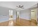 Spacious bedroom with hardwood floors; the ensuite bath and walk-in closet are visible at 1570 Barking Deer Cv, Casselberry, FL 32707