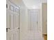 The foyer hallway offers tile floors with multiple doors at 1570 Barking Deer Cv, Casselberry, FL 32707