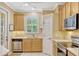 A kitchen features stainless appliances, plenty of cabinets, and a window at 1570 Barking Deer Cv, Casselberry, FL 32707