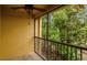 Screened patio with a ceiling fan and a view of mature trees at 1570 Barking Deer Cv, Casselberry, FL 32707