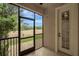 Screened in patio with a view of a green lawn, trees, and blue sky at 1570 Barking Deer Cv, Casselberry, FL 32707