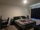 Bedroom features a cozy bed, desk area, and ample space for personalization at 1596 Park Side Ave, Kissimmee, FL 34744