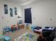 Playful bedroom includes colorful decor, bed and ample space for creativity at 1596 Park Side Ave, Kissimmee, FL 34744