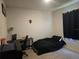 Bedroom includes a clean layout and dark furnishings, designed for rest and sleep at 1596 Park Side Ave, Kissimmee, FL 34744