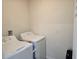 Functional laundry room includes a washer and dryer for convenient chores at 1596 Park Side Ave, Kissimmee, FL 34744