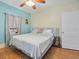 Bright bedroom with hardwood floors and neutral decor at 16 E Orange Street St, Davenport, FL 33837