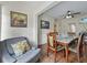 Cozy dining room features hardwood floors, natural light, and decorative artwork at 16 E Orange Street St, Davenport, FL 33837