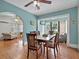 Elegant dining room with an open floor plan, hardwood floors, and plenty of light, great for gatherings at 16 E Orange Street St, Davenport, FL 33837