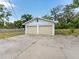 Two-car garage with a large driveway, offering ample parking and storage at 16 E Orange Street St, Davenport, FL 33837