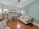Cozy living room with a classic brick fireplace and built-in shelving creates a warm and inviting atmosphere at 16 E Orange Street St, Davenport, FL 33837