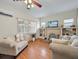 Inviting living room features a decorative fireplace, hardwood floors, and bright, natural light at 16 E Orange Street St, Davenport, FL 33837