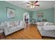 Comfortable living room with hardwood floors and soft, natural light streaming through the arched doorway at 16 E Orange Street St, Davenport, FL 33837