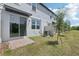 Townhome backyard with brick paver patio and grassy area at 16395 Bird Of Paradise Ave, Clermont, FL 34714