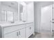 Bathroom features double sink vanity and neutral tiling at 16395 Bird Of Paradise Ave, Clermont, FL 34714