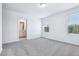 Bedroom with ensuite bathroom and natural light from the two windows at 16395 Bird Of Paradise Ave, Clermont, FL 34714