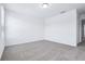Well lit bedroom space with neutral-toned carpet at 16395 Bird Of Paradise Ave, Clermont, FL 34714