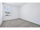 Bright bedroom with carpet, a window with blinds for privacy, and a comfortable atmosphere at 16395 Bird Of Paradise Ave, Clermont, FL 34714