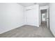 Bedroom featuring closet, carpet, a connecting door to another room, and neutral decor at 16395 Bird Of Paradise Ave, Clermont, FL 34714
